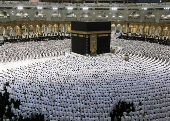 TOPSHOT - Muslims pray around the Kaaba, Islam's holiest shrine, at the Grand Mosque complex in the Saudi city of Mecca, during the fasting month of Ramadan, on April 9, 2022. - Saudi Arabia said today it will permit one million Muslims from inside and outside the country to participate in this year's hajj, a sharp uptick after pandemic restrictions forced two years of drastically pared-down pilgrimages. (Photo by Abdel Ghani BASHIR / AFP) (Photo by ABDEL GHANI BASHIR/AFP via Getty Images)