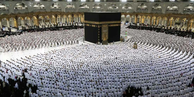 TOPSHOT - Muslims pray around the Kaaba, Islam's holiest shrine, at the Grand Mosque complex in the Saudi city of Mecca, during the fasting month of Ramadan, on April 9, 2022. - Saudi Arabia said today it will permit one million Muslims from inside and outside the country to participate in this year's hajj, a sharp uptick after pandemic restrictions forced two years of drastically pared-down pilgrimages. (Photo by Abdel Ghani BASHIR / AFP) (Photo by ABDEL GHANI BASHIR/AFP via Getty Images)