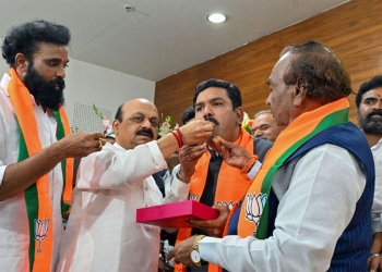 Bengaluru: Former Karnataka chief minister Basavaraj Bommai offers sweets to newly appointed State BJP President B.Y. Vijayendra during the charge taking funtion at party office, in Bengaluru, Wednesday, Nov. 15, 2023. (PTI Photo)(PTI11_15_2023_000392B)
