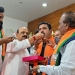 Bengaluru: Former Karnataka chief minister Basavaraj Bommai offers sweets to newly appointed State BJP President B.Y. Vijayendra during the charge taking funtion at party office, in Bengaluru, Wednesday, Nov. 15, 2023. (PTI Photo)(PTI11_15_2023_000392B)